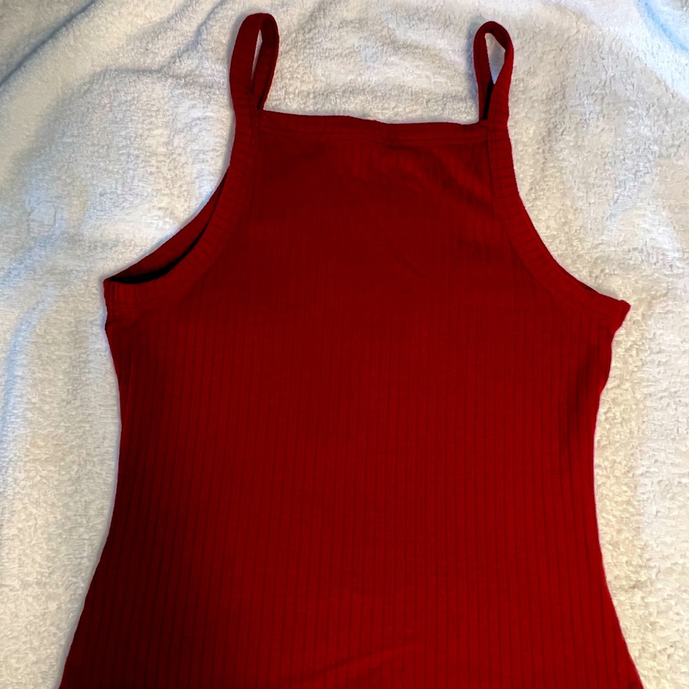 It’s a medium and fits perfect, burgundy color & great for when hot